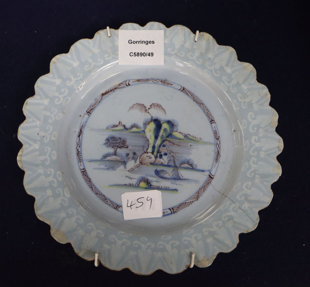 A Bristol Delft petal rimmed dish with Bianco Sopra Bianco border, diameter 22cm, cracked